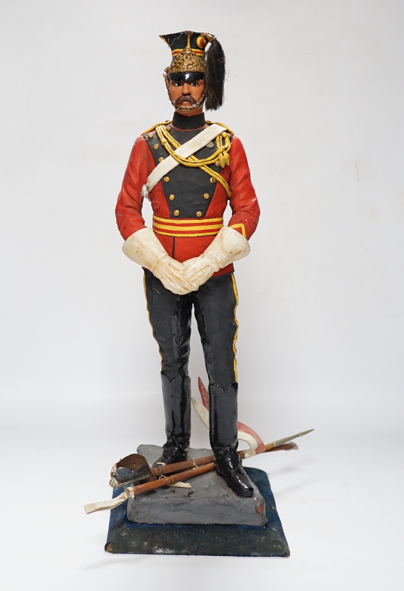 A painted plaster figure of a lancer, 48cm